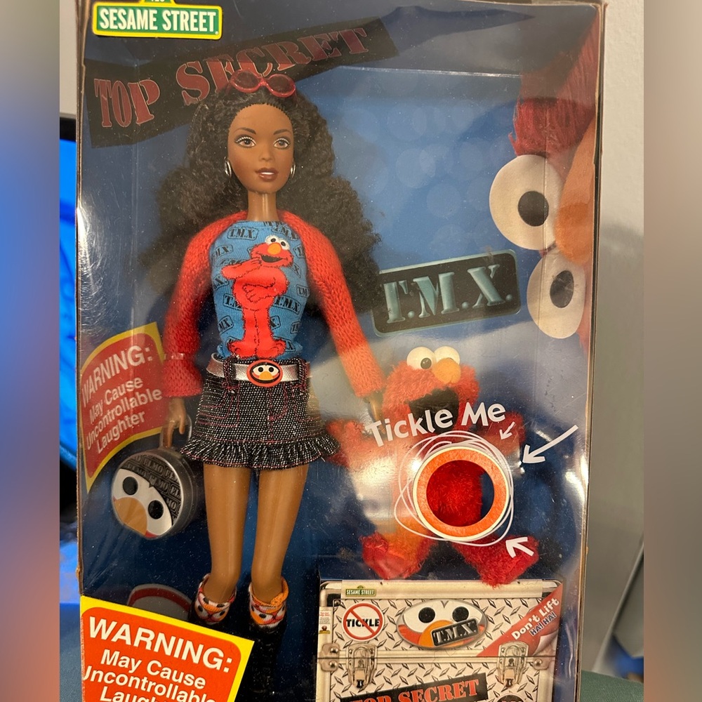Vintage Barbie and Elmo in original box. Collector’s item.